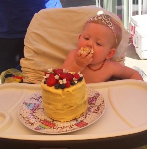 Payton eating 1st birthday smash cake